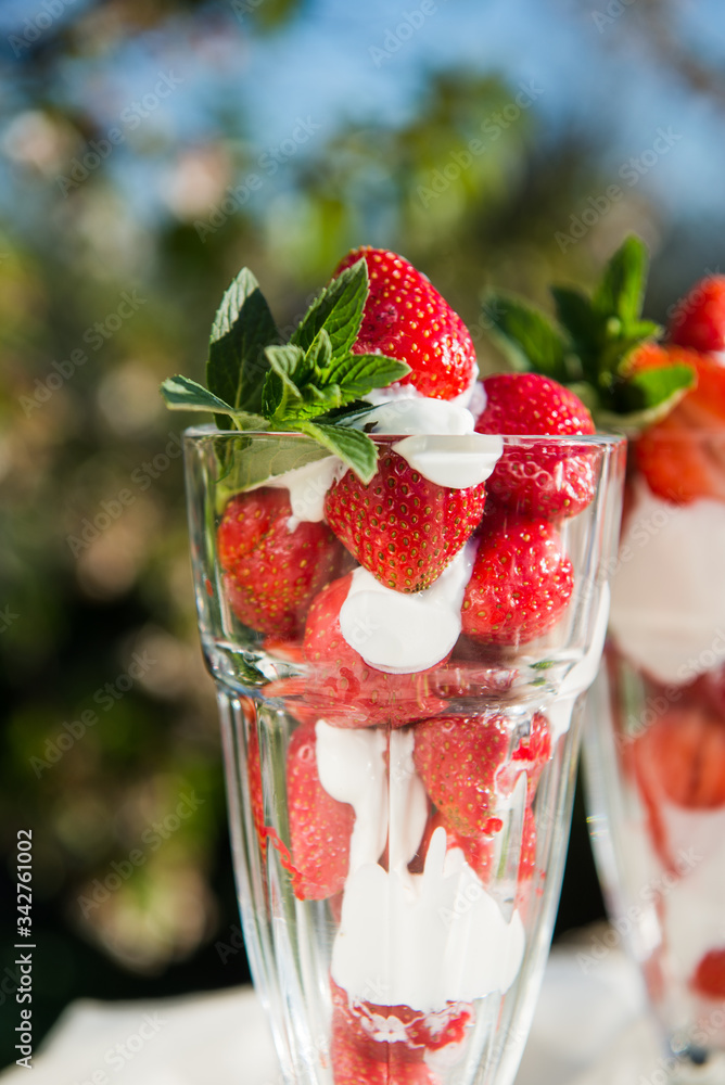 Fresh strawberries with yoghurt and whipped cream. Breakfast time. Healthy food. Delicious dessert sugar free. Vegetarian dish. Spring time Fresh strawberries with yoghurt and whipped cream. Breakfast time. Healthy food. Delicious dessert sugar free. Vegetarian dish. Spring time