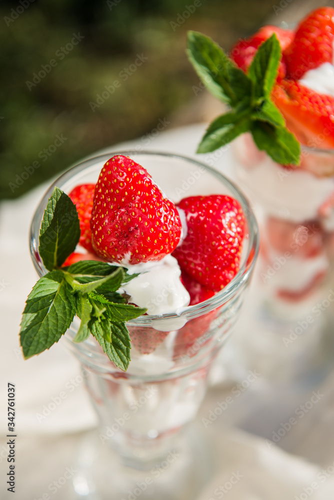 Fresh strawberries with yoghurt and whipped cream. Breakfast time. Healthy food. Delicious dessert sugar free. Vegetarian dish. Spring time Fresh strawberries with yoghurt and whipped cream. Breakfast time. Healthy food. Delicious dessert sugar free. Vegetarian dish. Spring time