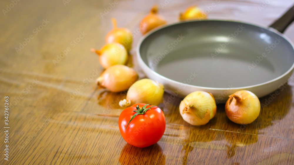 Cooking. Onions And Tomatoes Dance Around The Frying Pan. Cooking. Onions And Tomatoes Dance Around The Frying Pan.