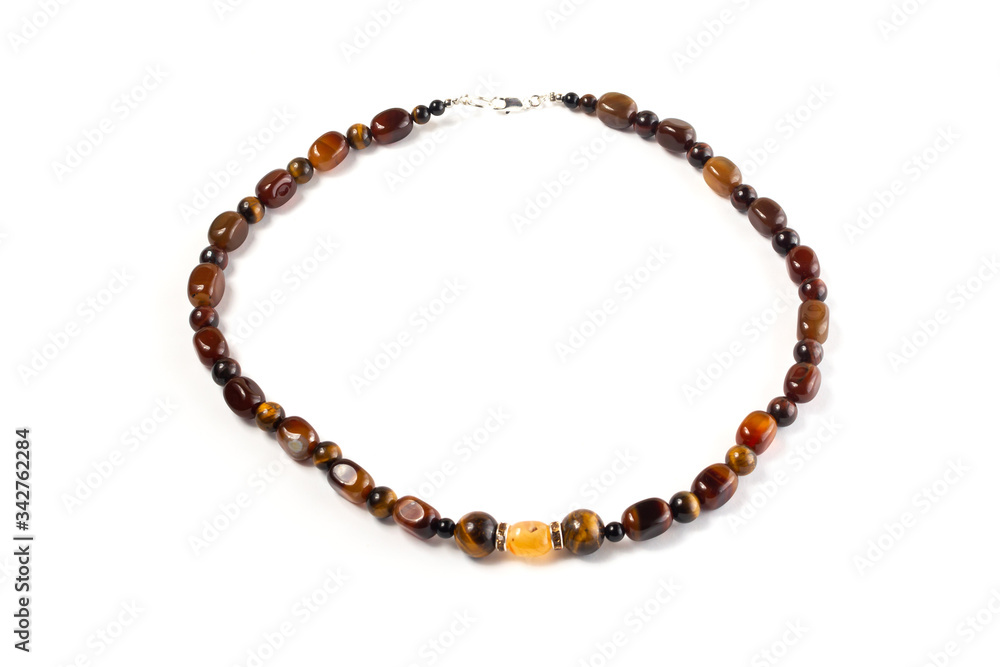 beads from a natural Tiger eye, Carnelian on a white background isolate beads from a natural Tiger eye, Carnelian on a white background isolate