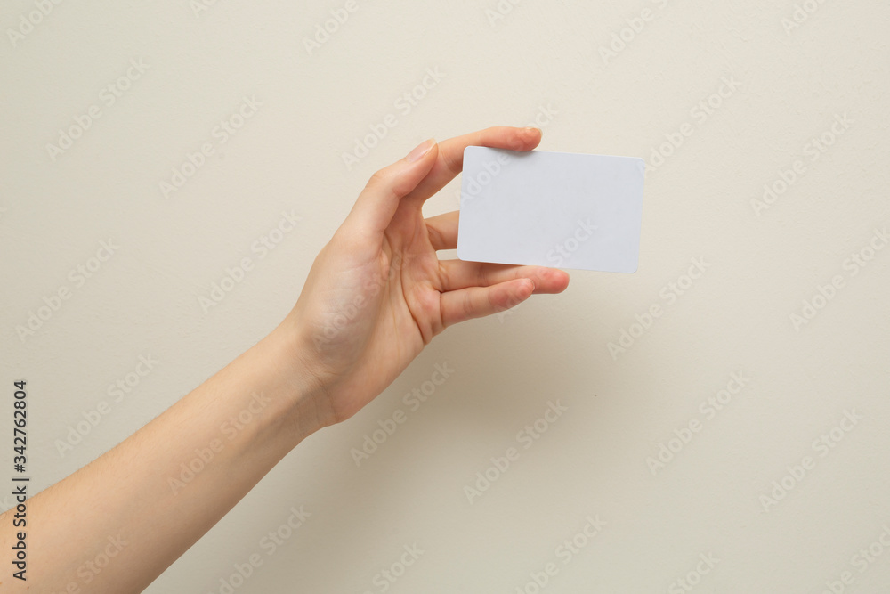 Woman hand holding white card Woman hand holding white card