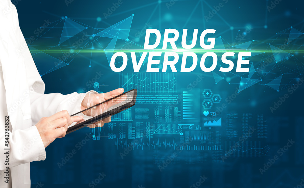doctor writes notes on the clipboard with DRUG OVERDOSE inscription, medical diagnosis concept doctor writes notes on the clipboard with DRUG OVERDOSE inscription, medical diagnosis concept