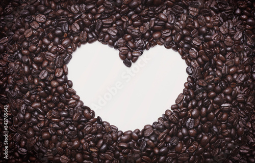 Love coffee concept. Roasted coffee beans background. Close up.