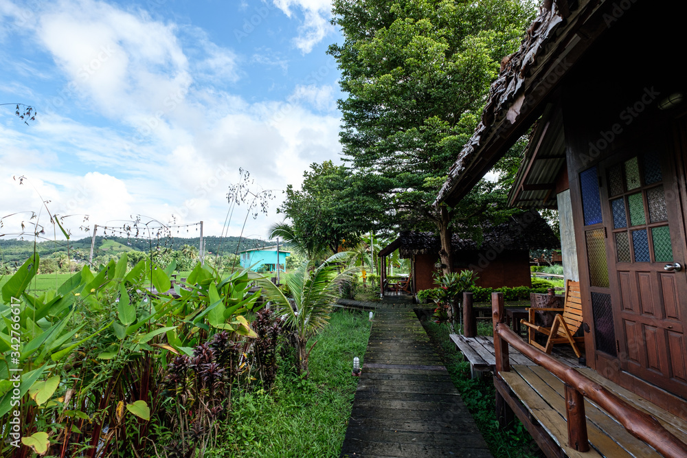 A resort beside rice fields and mountains during the rainy season in Mae La Noi District, Mae Hong Son Province of Thailand. A resort beside rice fields and mountains during the rainy season in Mae La Noi District, Mae Hong Son Province of Thailand.