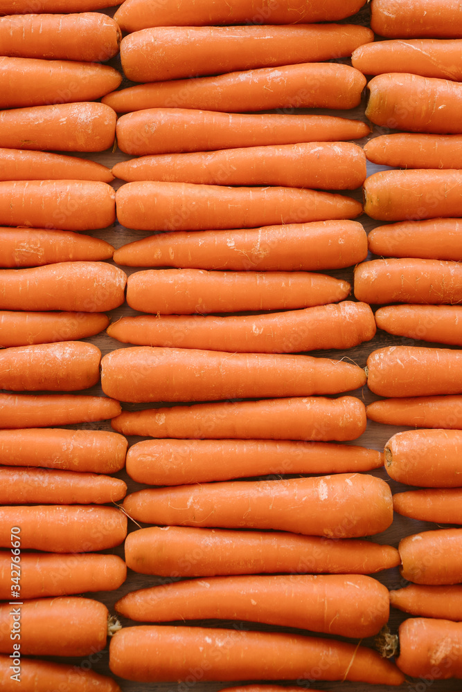Organic carrots as texture and background. Top view. Organic and healthy food. Organic carrots as texture and background. Top view. Organic and healthy food.