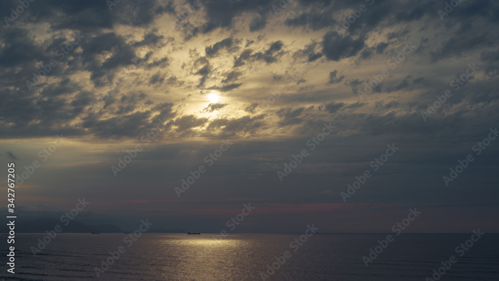 Photography of the Atlantic ocean at the cold blue sunset. Northern Spain, Basque country is full of wideness and freshness. The beauty of nature concepts. Back lit