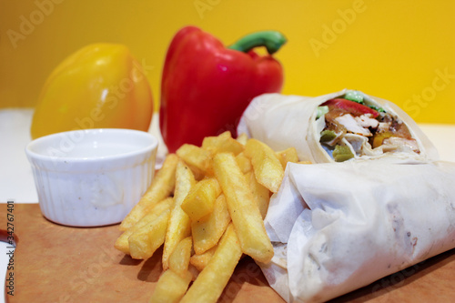 shawerma, shawarma tourtilla wrap with onion, tomato, lettuce and garilc sauce photo