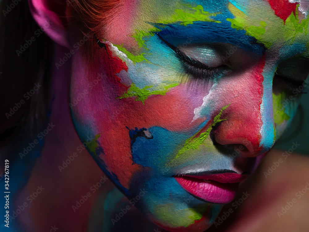 Multicolored skin, difficult to identify. Creative makeup and drawing on the face. - obrazy, fototapety, plakaty 