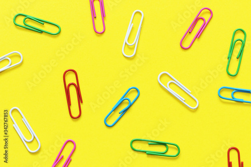 paper clips on a yellow background