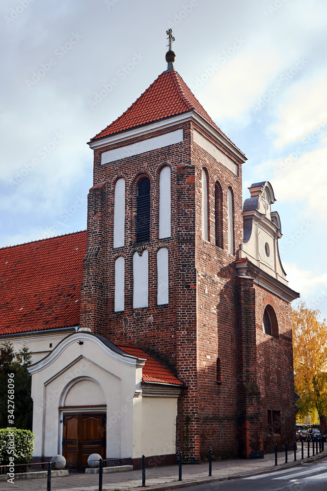 Obraz premium Gothic parish church with belfry in Gniezno.