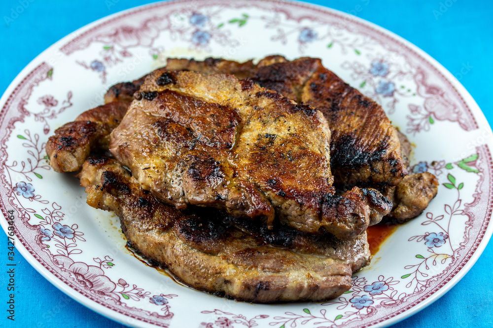 Juicy, delicious beef steak cooked in a frying pan Juicy, delicious beef steak cooked in a frying pan