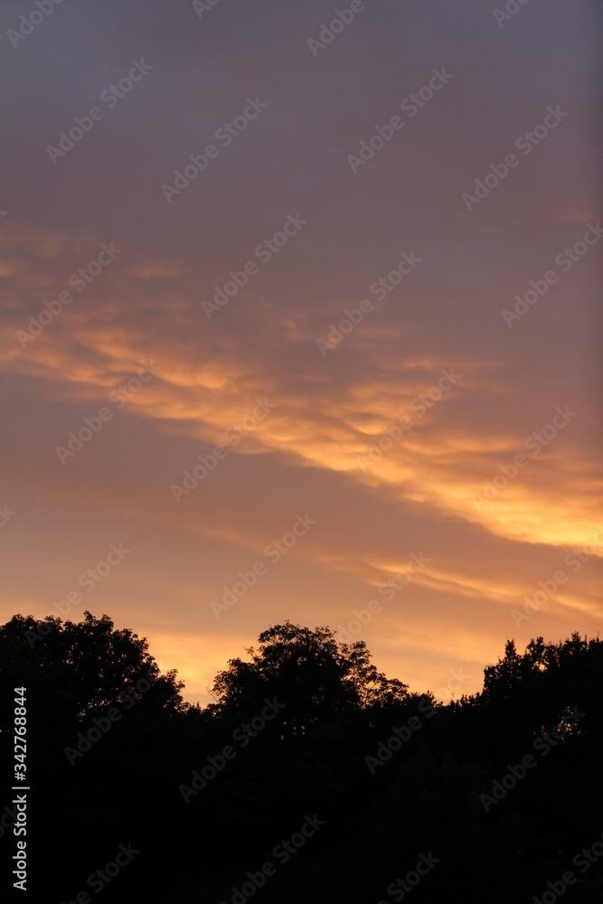 Beautiful and vibrant sunset, with the colours changing from a pink/orange colour into a clear blue sky