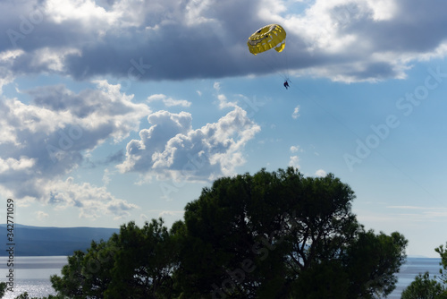 Summer season activity. Glider flying over beautiful beach in Bela, Croatia photo