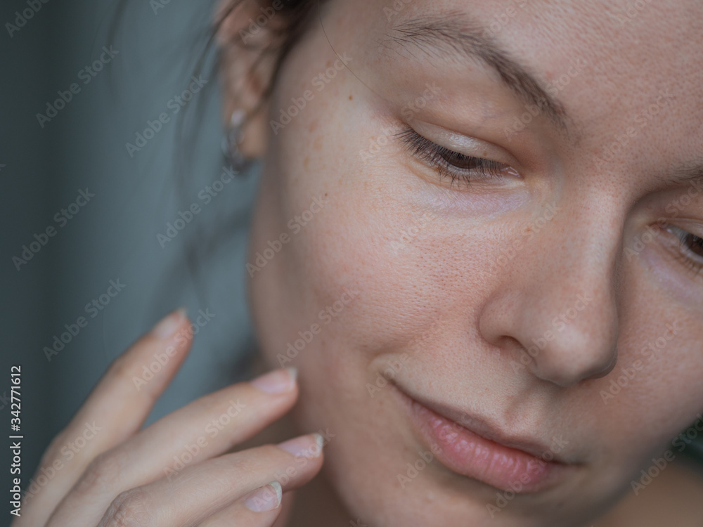 Skin care, portrait of a young beautiful woman close-up, without makeup and retouching. Skin care, portrait of a young beautiful woman close-up, without makeup and retouching.