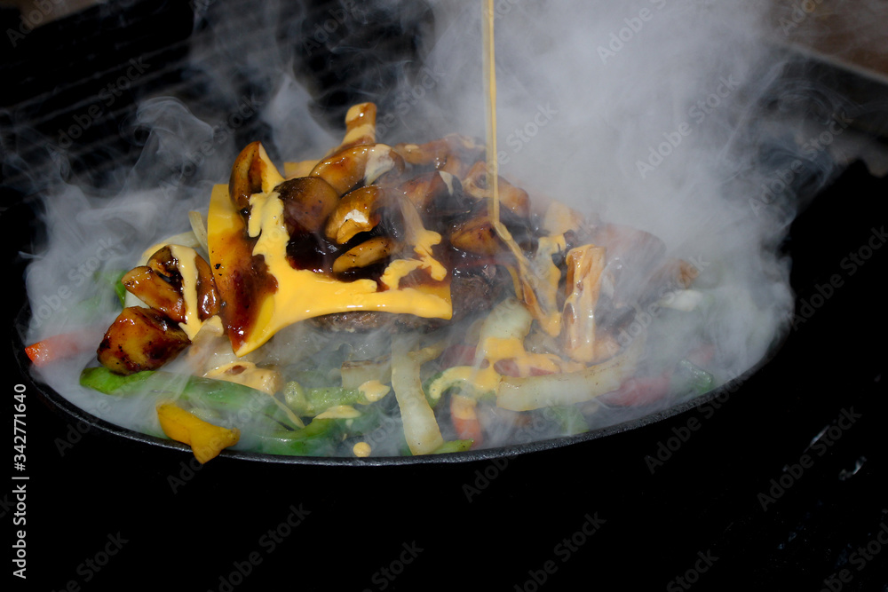 Tasty grilled beef burger with lettuce and mayonnaise AND cheese with souse 