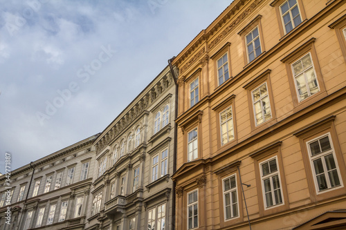 Typical Medieval Facade of an old appartment residential building in a street of old town, the historical center of Prague, Czech Republic, in the most touristic part of the city. © Jerome