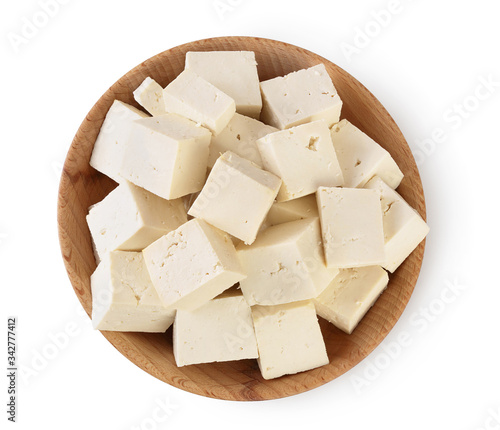 tofu cheese in wooden bowl isolated on white background with clipping path and full depth of field, Top view. Flat lay