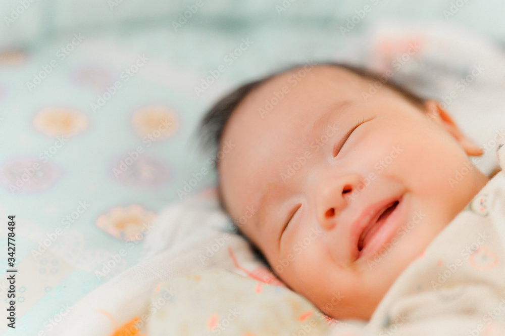 Smiling baby boy lying on a white bed, Family morning at home,Children hygiene. Smiling baby boy lying on a white bed, Family morning at home,Children hygiene.