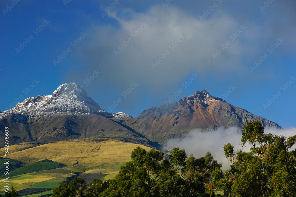 ILINIZA VOLCANO, ECUADOR - DECEMBER 03, 2019: View towards the peaks of the mountain emerging from the mist
