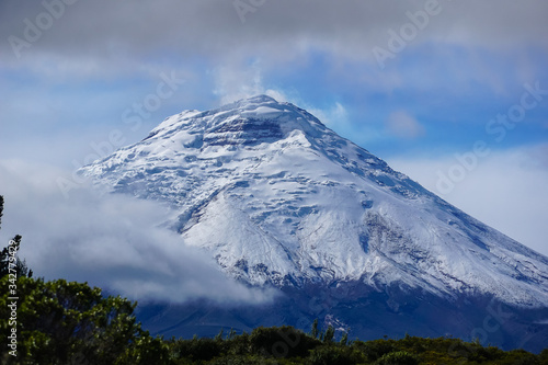 COTOPAXI VOLCANO  ECUADOR - DECEMBER 05  2019  View towards the snow covered volcanic cone above the clouds