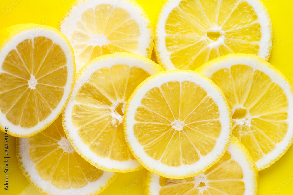 Background from bright juicy sliced lemon slices. Background from bright juicy sliced lemon slices.