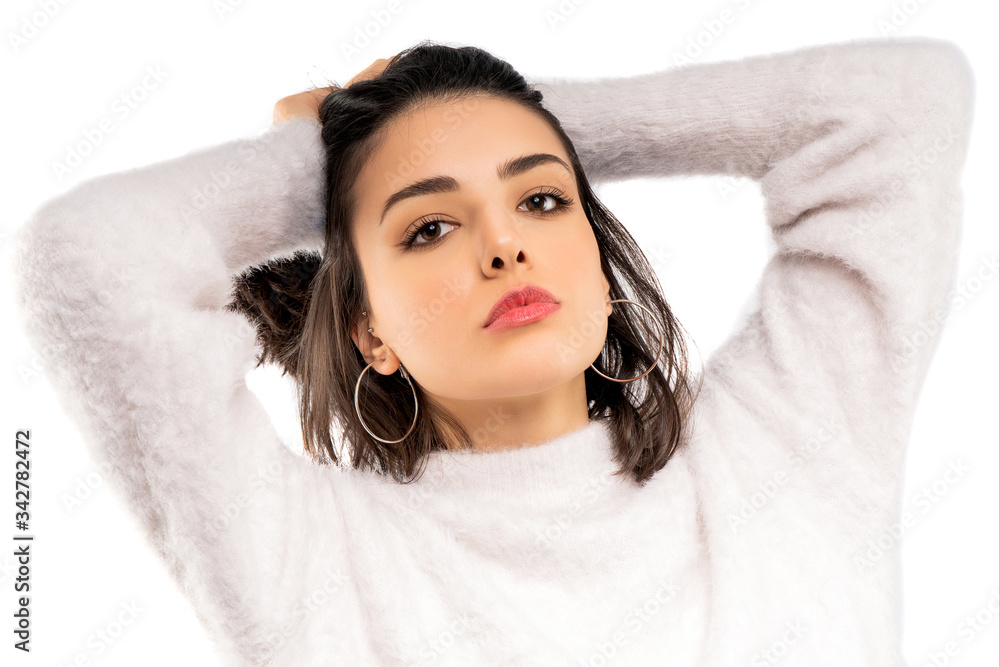 Brunette girl holding her black hair isolated on white background. Portrait of beauty girl. Brunette girl holding her black hair isolated on white background. Portrait of beauty girl.