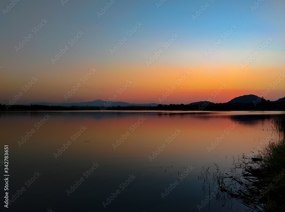 Sunset over the reservoir in Thailand