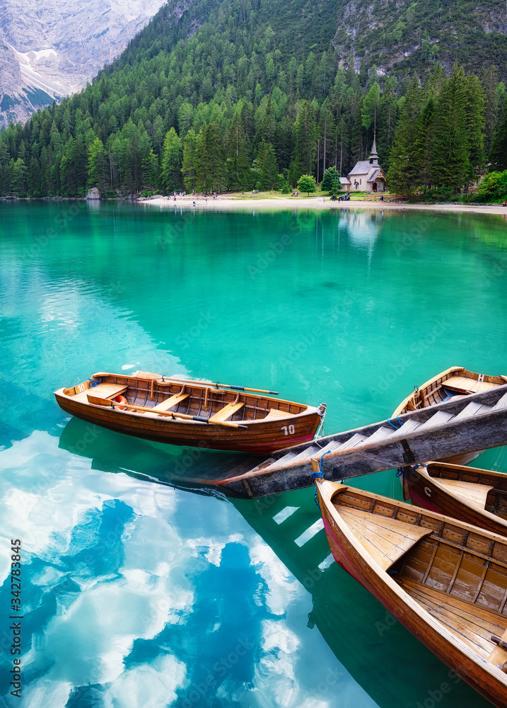 Lago di Braers lake, Dolomite Alps, Italy. Boats on the lake. Landscape in the Dolomite Alps, Italy. Pragser Wildsee - Image