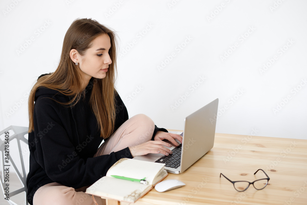 Smart young woman happy with language learning during online courses using a netbook, smiling student with a notebook Smart young woman happy with language learning during online courses using a netbook, smiling student with a notebook
