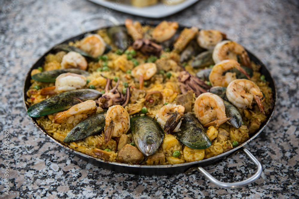 Fototapeta premium Spanish Paella - traditional recipe of rice with seafood