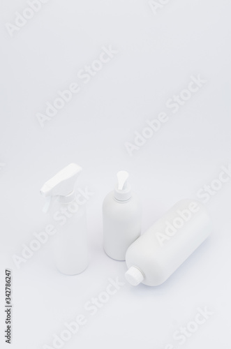 white plastic bottles on a white background