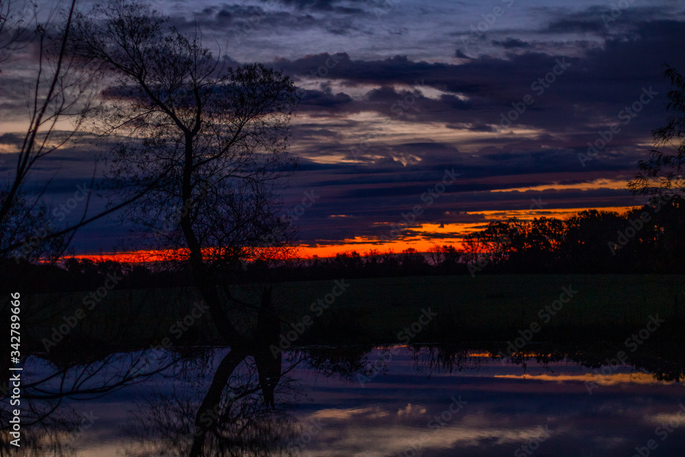 Fototapeta premium sunset over the lake