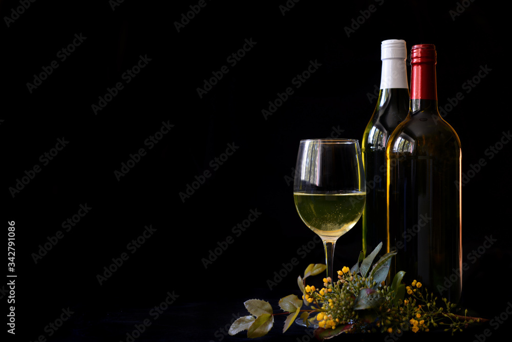 Background for celebrations, wine glasses and wine bottles on a black background