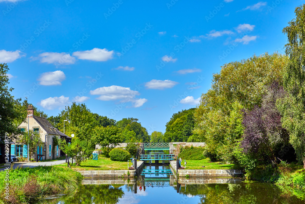 Lock on the Canal d'ille et rance, Brittany, France in the sunshine.