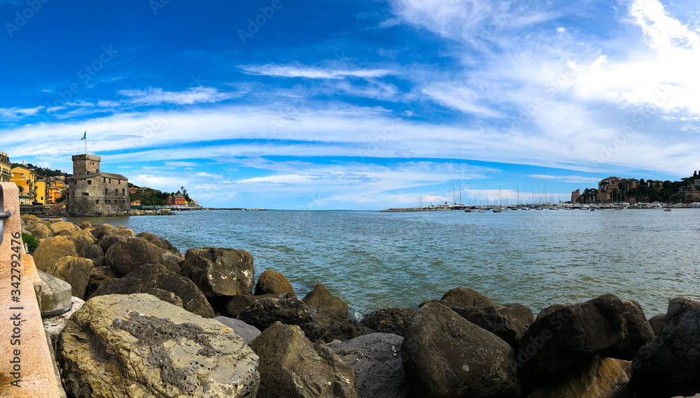 Panoramic view of the historical Castello sul Mare (Castle-on-the-Sea), built in 1551 as a defensive fort against pirates in Rapallo, Genoa, Liguria, Italy. Beautiful Mediterranean landscape of Rapall