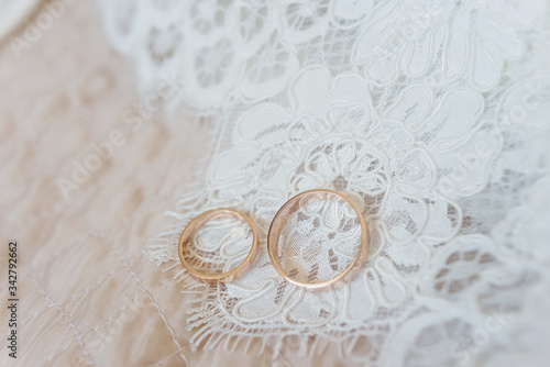 two wedding rings on white background