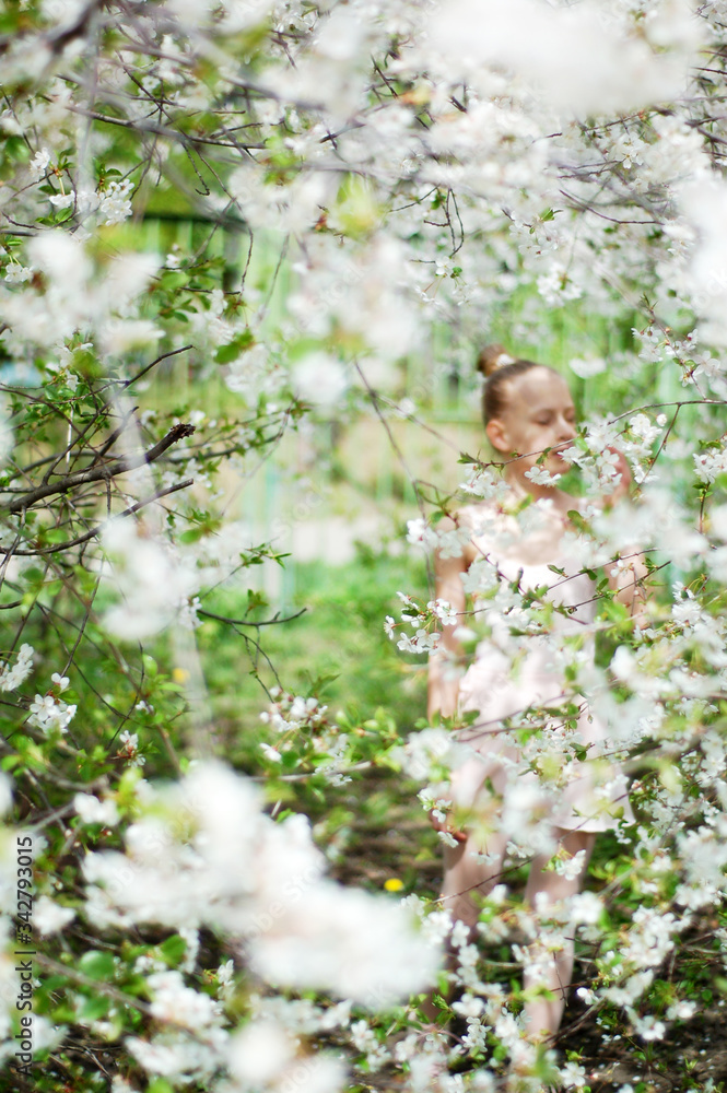Young ballerina in the spring garden Young ballerina in the spring garden