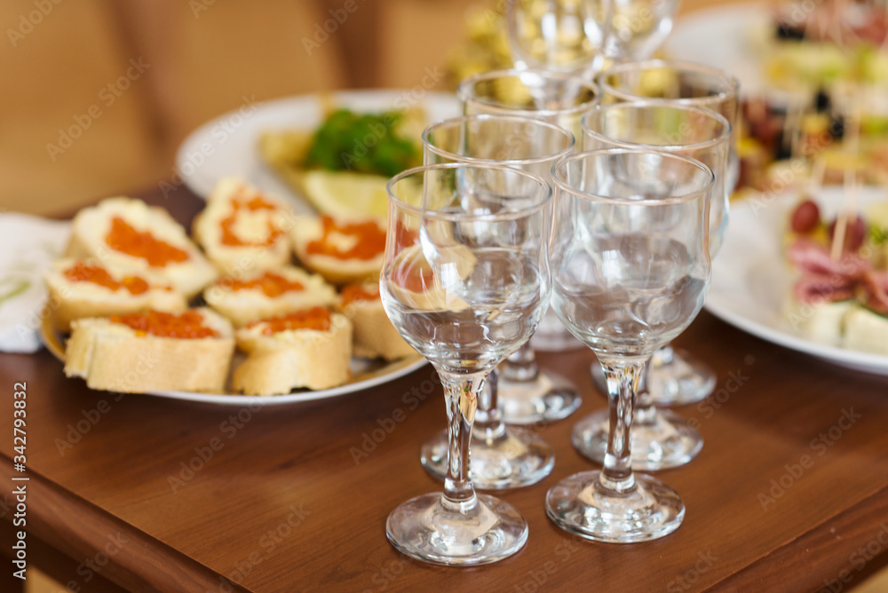 Served banquet decorated table. Wedding decorations in banquet hall. Delicious meal Served banquet decorated table. Wedding decorations in banquet hall. Delicious meal