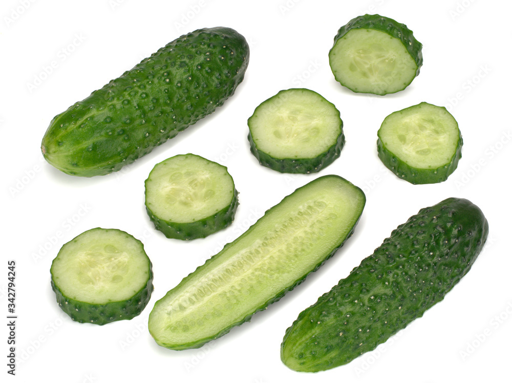 Cucumber and its slices and a half isolated on white background Cucumber and its slices and a half isolated on white background