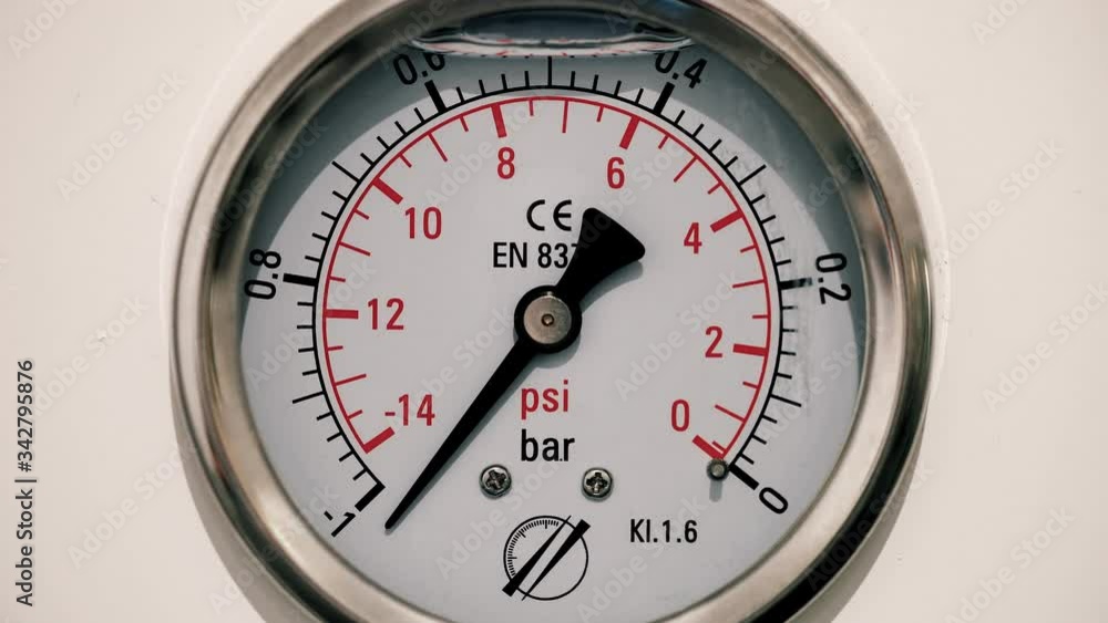 Barometer measuring pressure in industry. We can see the pressure gauge going up and down Barometer measuring pressure in industry. We can see the pressure gauge going up and down
