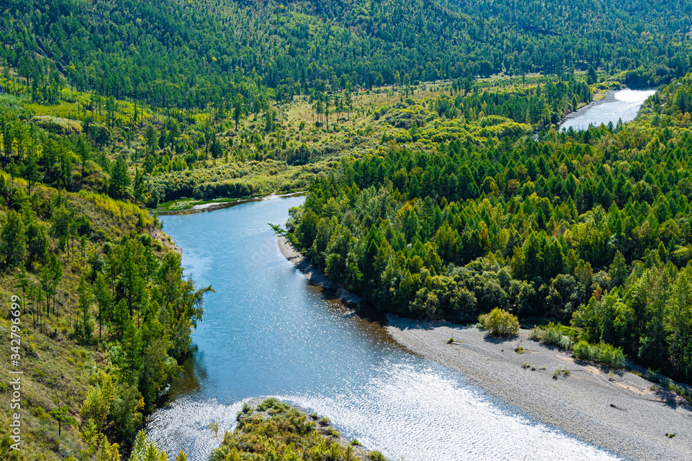 bend of riverbed among green forest, river valley bend of riverbed among green forest, river valley