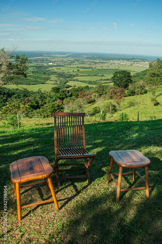 Wooden stool and chair in the shade Wooden stool and chair in the shade
