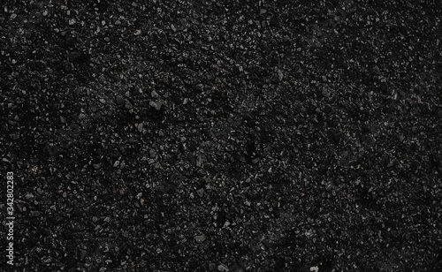 Seamless dark asphalt texture in horizontal aspect ratio. Big grains.