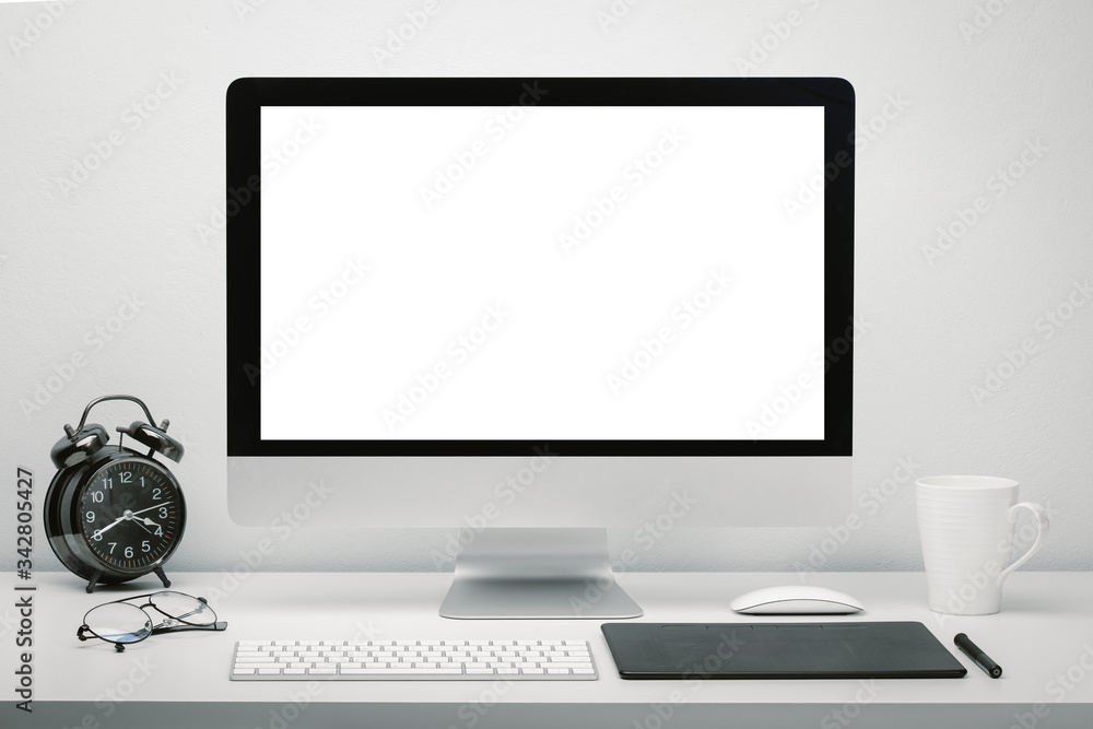 Stylish workspace with blank screen computer display for mockup on work desk with keyboard, mouse, cup of coffee, clock, eyeglasses and pen tablet. Stylish workspace with blank screen computer display for mockup on work desk with keyboard, mouse, cup of coffee, clock, eyeglasses and pen tablet.