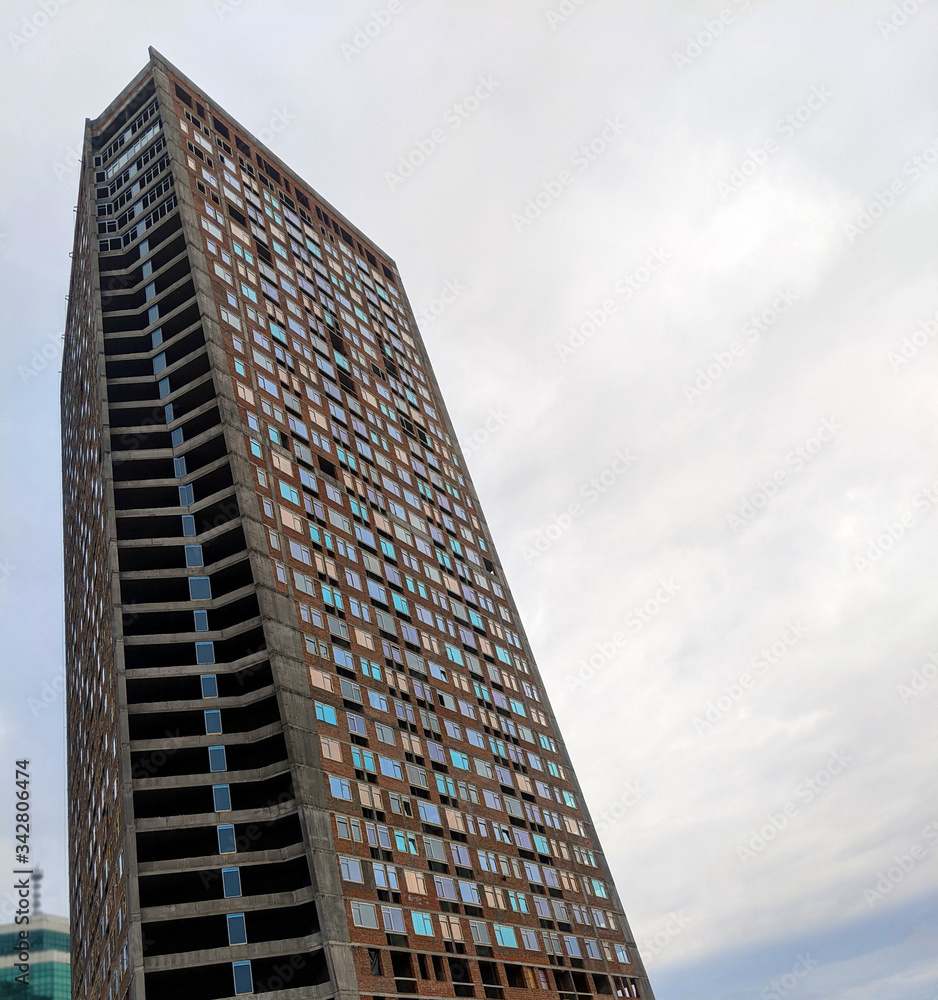 Modern building construction with curved diagonal shape in Kyiv downtown district