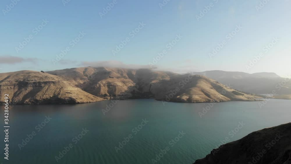 Sunrise in the bay. Aerial View of the Coastline. Pacific Ozean. New Zealand. Drone Shot. 4K. Sunrise in the bay. Aerial View of the Coastline. Pacific Ozean. New Zealand. Drone Shot. 4K.