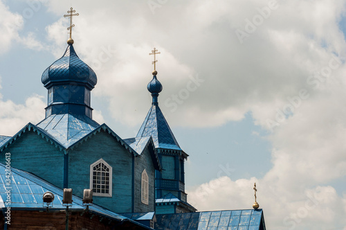 Blue turrets of the church on a cloudy sky