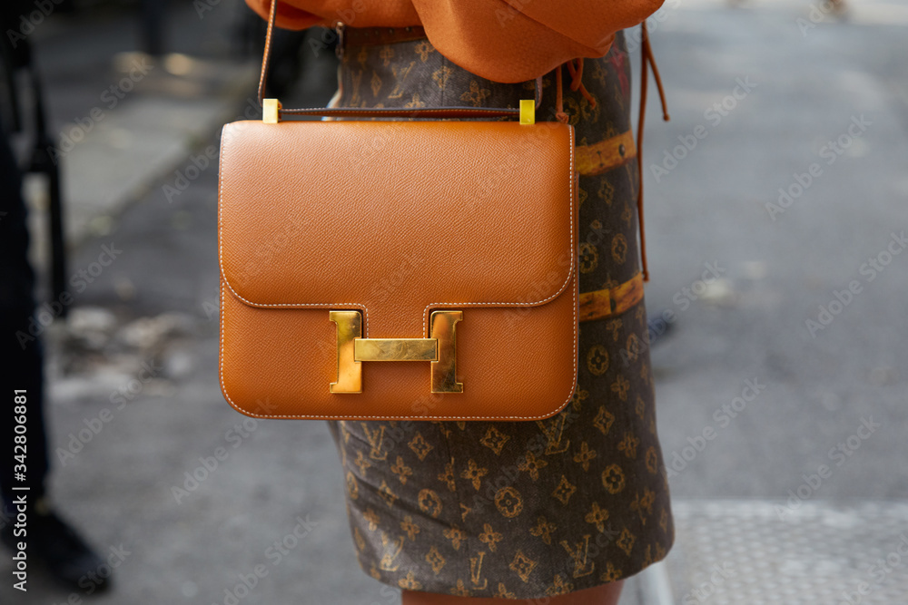 MILAN, ITALY - SEPTEMBER 22, 2018: Woman with brown Louis Vuitton