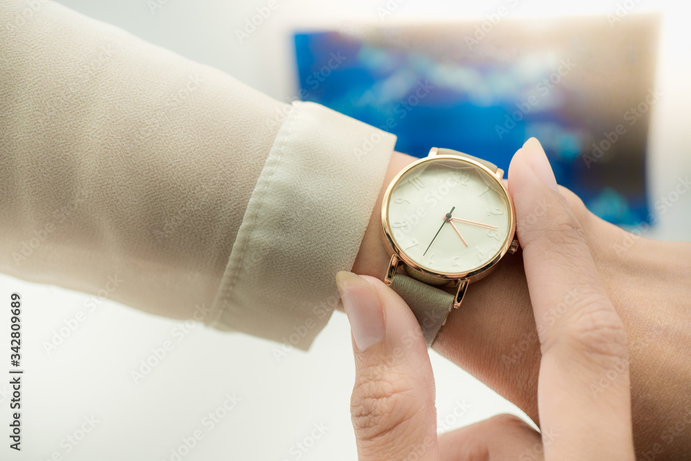 Woman look at watch with copy space using as background technology, business time concept. Woman look at watch with copy space using as background technology, business time concept.