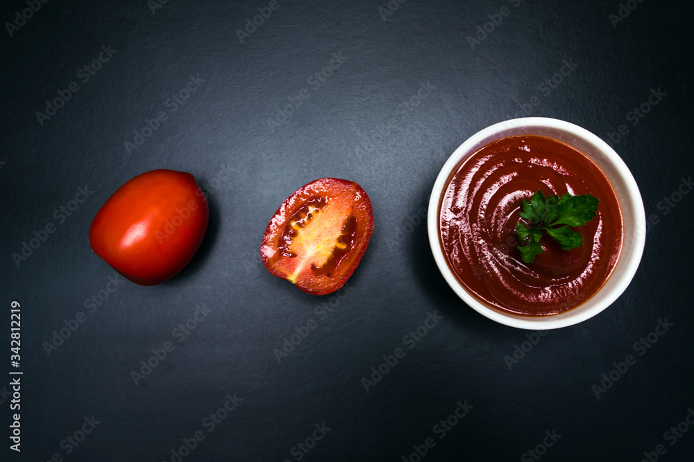 Tomatoes and tomato sauce in a white plate